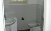 residence LE PALME: C6 - bagno con lavatrice (esempio)