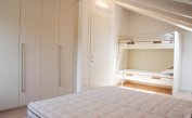 apartments Residenza GREEN MARINE: C8/4 - bedroom with bunk bed (example)